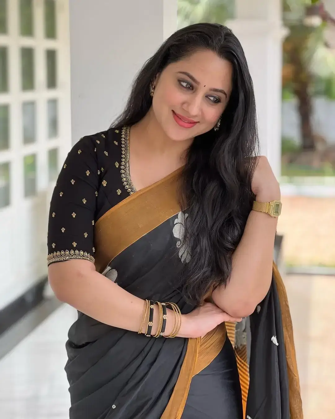 Beautiful Indian Queen Miya George in Traditional black Saree